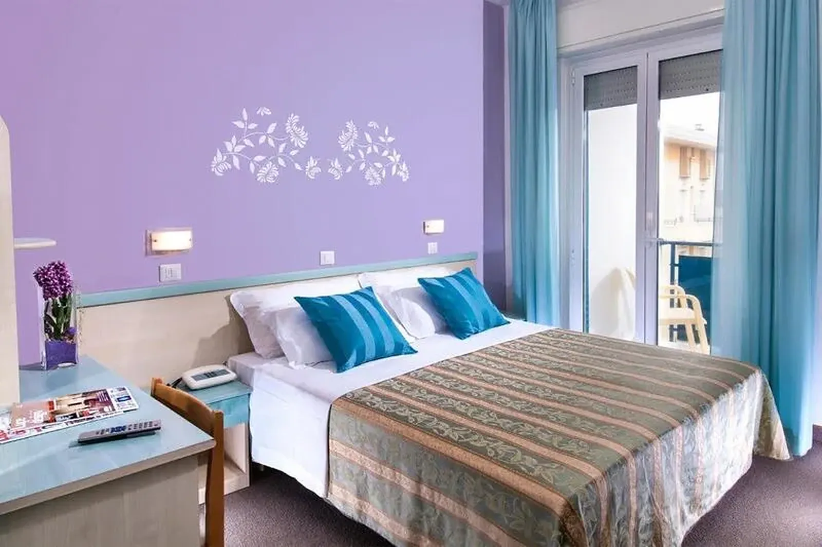 Purple bedroom with double bed, turquoise curtains and balcony access · Hotel Diana, Bellaria - Igea Marina